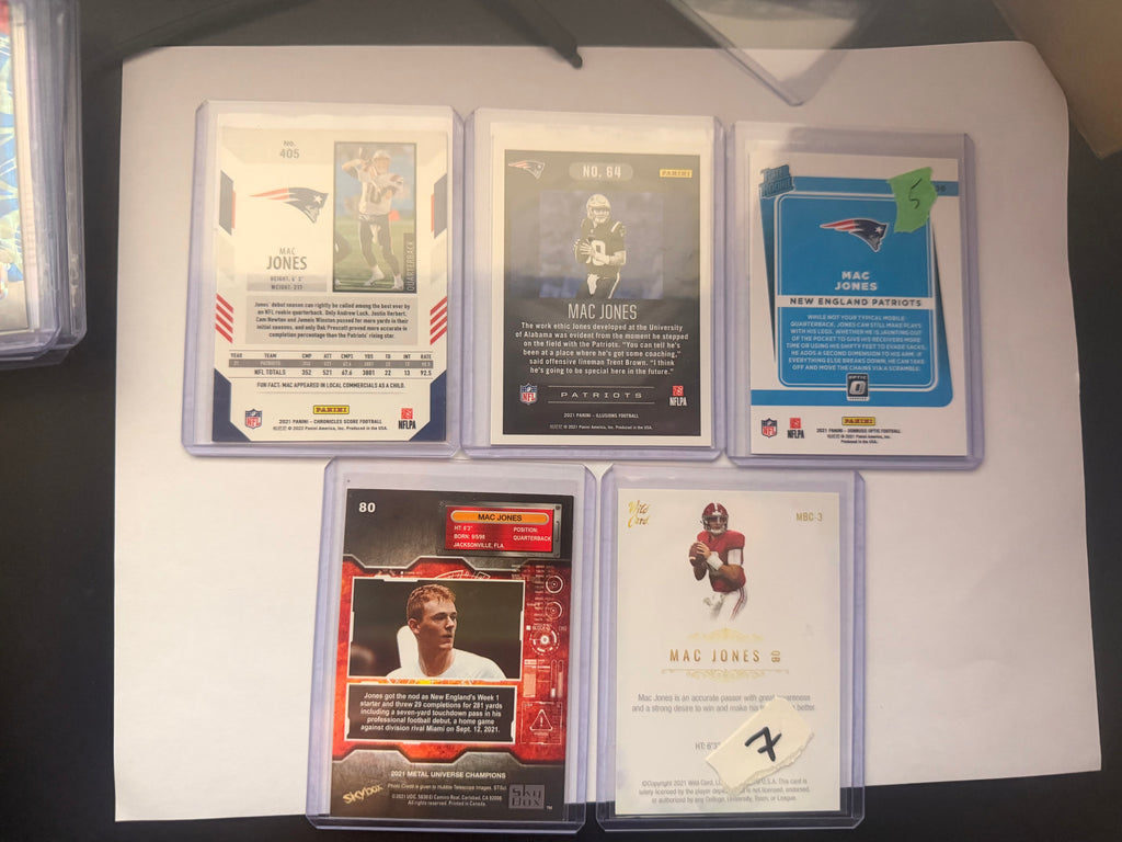 Mac Jones Rookie/Insert Lot – Score RC, Illusions, Donruss Optic Rated Rookie, Wild Card Matte, Metal Universe Champions (5-card mix).