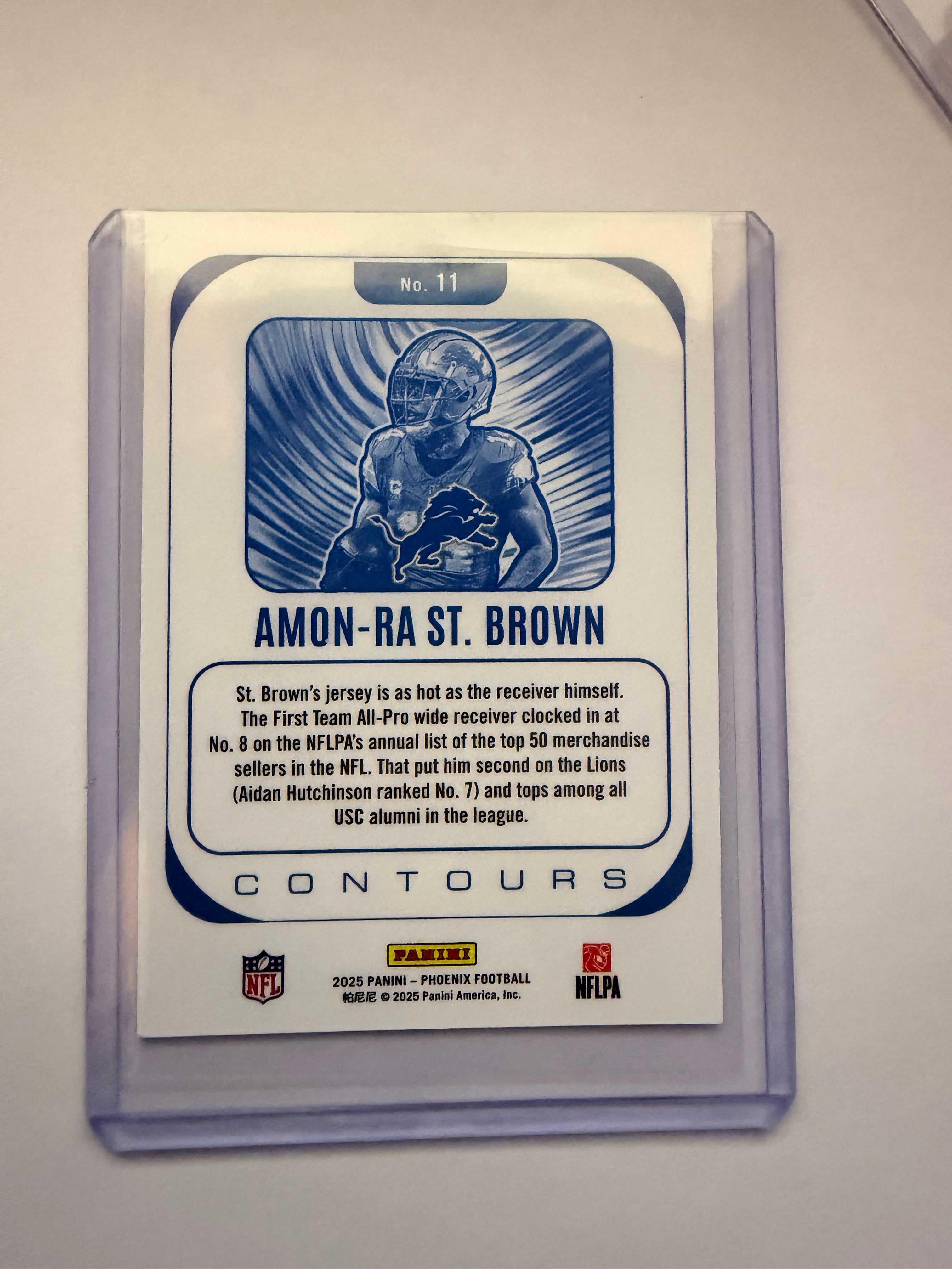 2025 Panini Phoenix “Contours” Amon-Ra St. Brown Insert – Detroit Lions. Clean star WR insert from Phoenix set