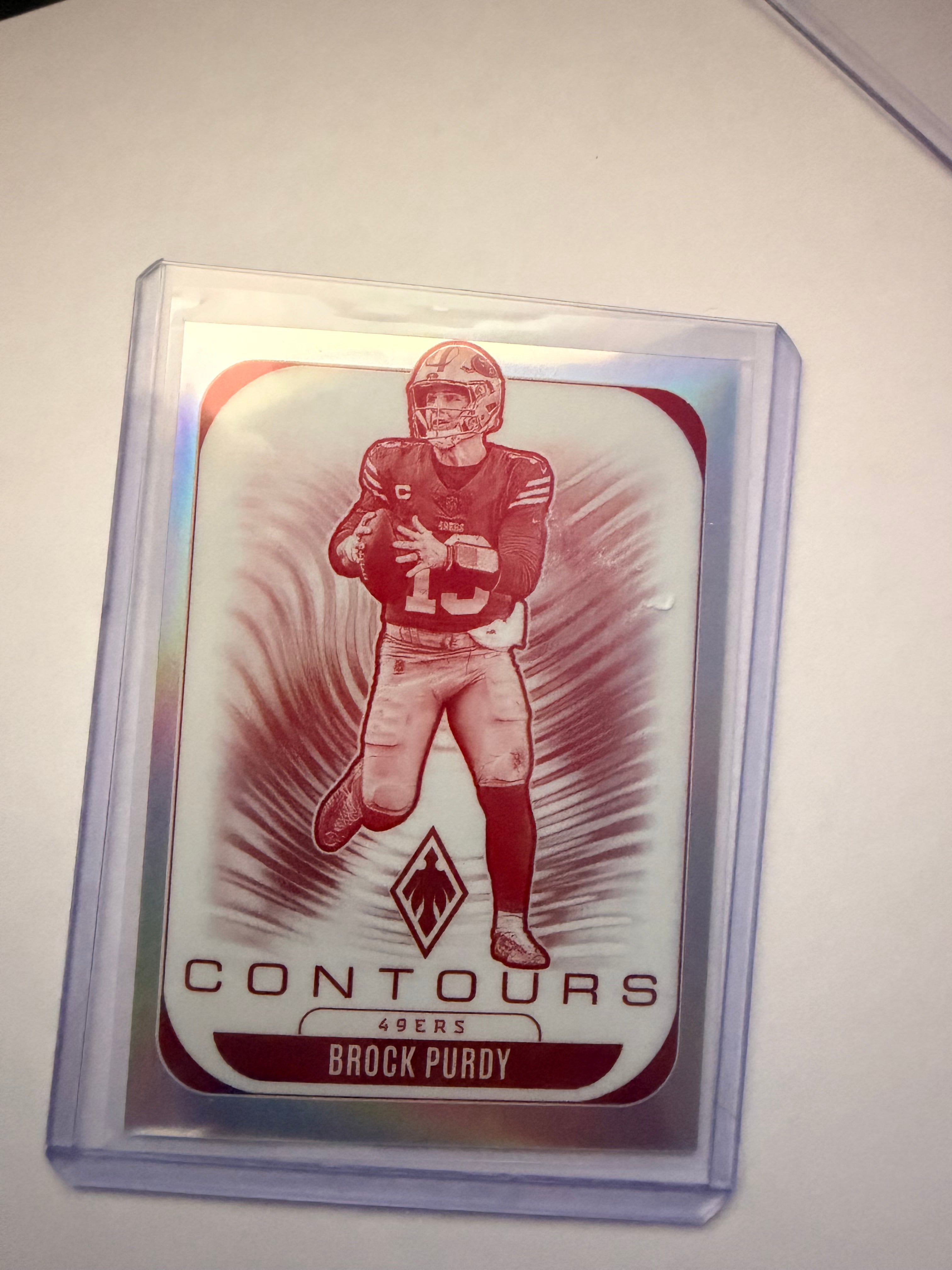 2025 Panini Phoenix “Contours” Brock Purdy Insert – San Francisco 49ers. Clean QB insert from Phoenix set.